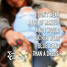 a woman holding a baby in her arms with the caption i don't wear a lot of makeup and i would rather rather rather wear blue jeans than a dress