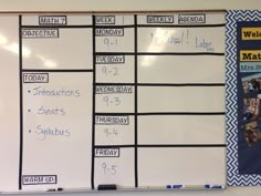 a white board with writing on it in front of a bulletin board that is written out