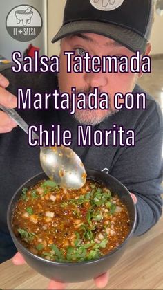 a man holding a bowl of food with a spoon in it and the caption says salsa tatenada margarita con chile morta