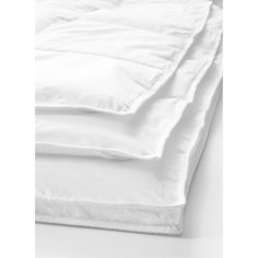 the white sheets are folded on top of each other