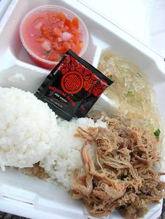 a lunch box with rice, meat and veggies