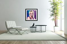 a white chair and table in a room with a potted plant on the floor