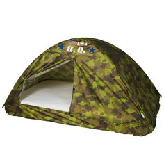 a camouflage print tent with the door open