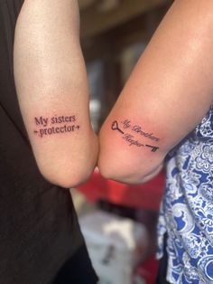 two people holding hands with tattoos on their arms that say, my sisters protector and i love you forever