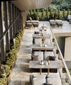 an outdoor seating area with tables and chairs