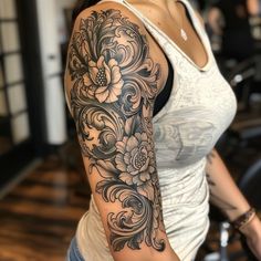 a woman with a flower tattoo on her arm