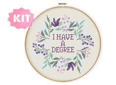 a cross stitch pattern with the words i have a degree written in purple on it