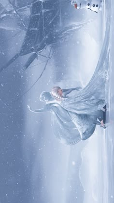 a woman in white dress flying through the air next to a snow covered forest with trees