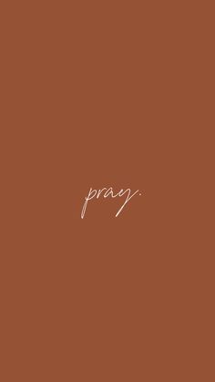 the word pray written in white ink on a brown background