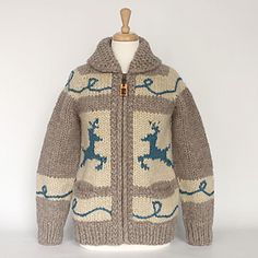 a knitted sweater with reindeers on it