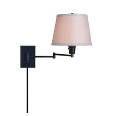 a wall lamp with a white shade on it's side and a black arm