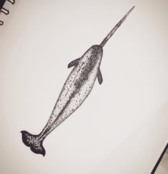 a drawing of a narwhale fish with spots on it's tail