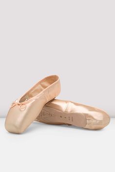 pair of ballet shoes on white background