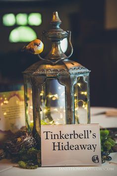 there is a sign on the table that says tinkerbell's hideaway