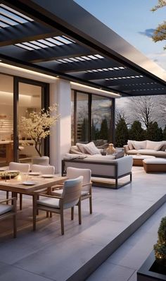 an outdoor living area with couches, tables and chairs