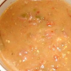 a white bowl filled with soup on top of a table