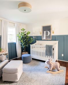 a baby's room is decorated in blue and white with polka dot rugs