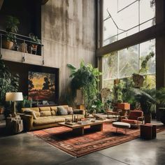 a living room filled with lots of furniture next to large windows and potted plants