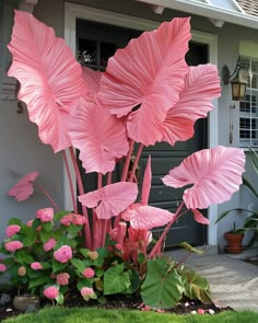 pink paper flowers in front of a house