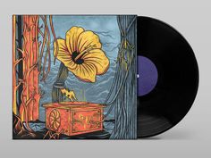 an orange and black record with a yellow flower on the cover, sitting in front of trees