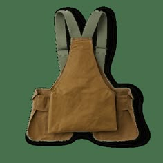 Our Tin Game Bag is a ruggedly durable hunting vest with over three decades of proven service. The rear game bag holds a limit of gamebirds and the expandable shell pockets each have the capacity for a box of shells. This classic hunting is engineered to maximize durability and freedom of movement, with adjustable cotton webbing shoulder straps and a Bridle Leather waist closure. | Filson Tin Cloth Game Bag Dark Tan Size Regular Backpack Design Concept, Old Fashioned Games, Gamebirds, Convertible Clothing, Shop Apron, Hunting Vest, Apocalyptic Fashion, Sink Or Swim, Bag Dark