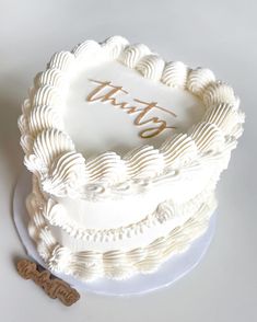 a white cake sitting on top of a table