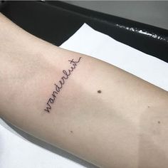 a person with a tattoo on their arm that says, i love you mama in cursive writing