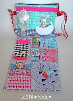 a small purse with many different items on the front and side, sitting on top of a table