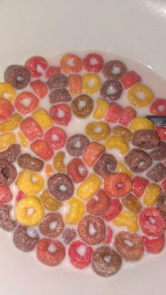 a white plate topped with donuts and cereal