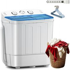 a washing machine next to a laundry basket