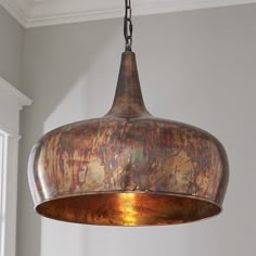 a large metal light fixture hanging from a ceiling