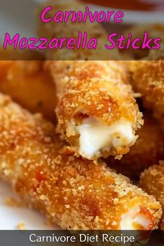 a close up of food on a plate with the words carnivor mozzarella sticks