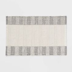 a white and black striped rug on top of a table