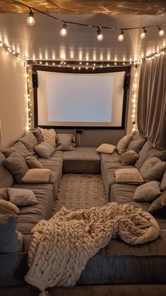 a living room filled with lots of couches and pillows on top of each other