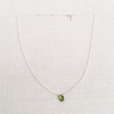 "This is a peridot necklace made of genuine high quality faceted peridot. There are gold filled ,sterling silver and 14kt gold chain you can choose from. Each necklace has 2\" extender. There are 2 sizes that you can choose from 14\"-16\" and 16\"- 18\" in gold filled or sterling silver. 14k gold necklace will be in single size without extender.This is a August birthstone necklace. Peridot jewelry is light weight and elegant. This green peridot is around 1 carats. The green stone necklace is gre Green Peridot Necklace For May Birthstone, Green Minimalist Gemstone Birthstone Necklace, Peridot Gemstone Necklace For May Birthstone, Lime Green Peridot Necklace For May Birthstone, Peridot Birthstone Necklace For May, Peridot Necklace With Round Pendant For Gift, Green Peridot Gemstone Necklace, Green Peridot Necklace For Gift, Green Birthstone Teardrop Pendant Necklace