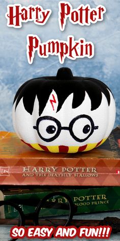 a harry potter pumpkin sitting on top of some books with the title harry potter pumpkin