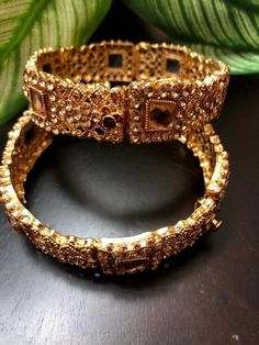 *Picture may be stretched or enlarged to show detail* Golden/bronze cuff bracelet pair embellished with rose gold stones - perfect for any occasion! Size: 2.6  *Openable to adjust size accordingly* Gold Bridal Sets For Party, Glamorous Kundan Jewelry For Wedding, Gold Bracelet Jewelry For Wedding, Metal Bracelets For Wedding, Gold Wedding Bracelet Jewelry, Luxury Jeweled Bracelet For Parties, Jeweled Party Bracelet, Party Jeweled Bracelet Jewelry, Gold Metal Bridal Sets For Wedding