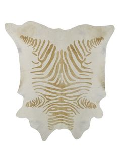 a white and gold animal skin rug with zebra stripes on the front, side, and back