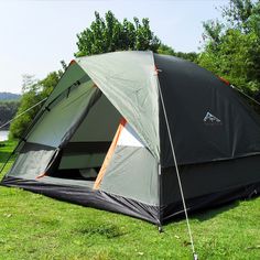 a tent is pitched up in the grass