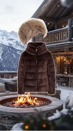 an outdoor fire pit with a fur hat on top