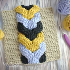 a crochet project with yarn and scissors