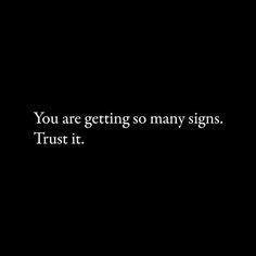 a black background with the words you are getting so many signs trust it