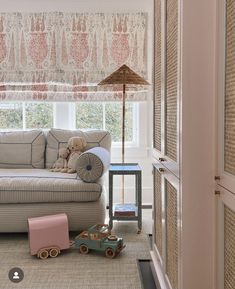 a living room filled with furniture and toys