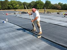 a man on a skateboard is standing on the tarp