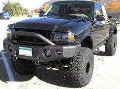 a black pickup truck parked in a parking lot