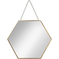 a gold hexagonal mirror hanging on a chain