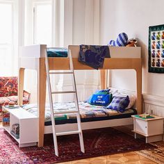 a bunk bed sitting in the middle of a living room