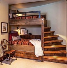 there is a bunk bed with stairs in the room