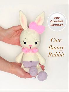 a crochet bunny rabbit doll sitting in someone's hand with the caption cute bunny rabbit