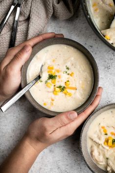 two bowls filled with soup on top of a table